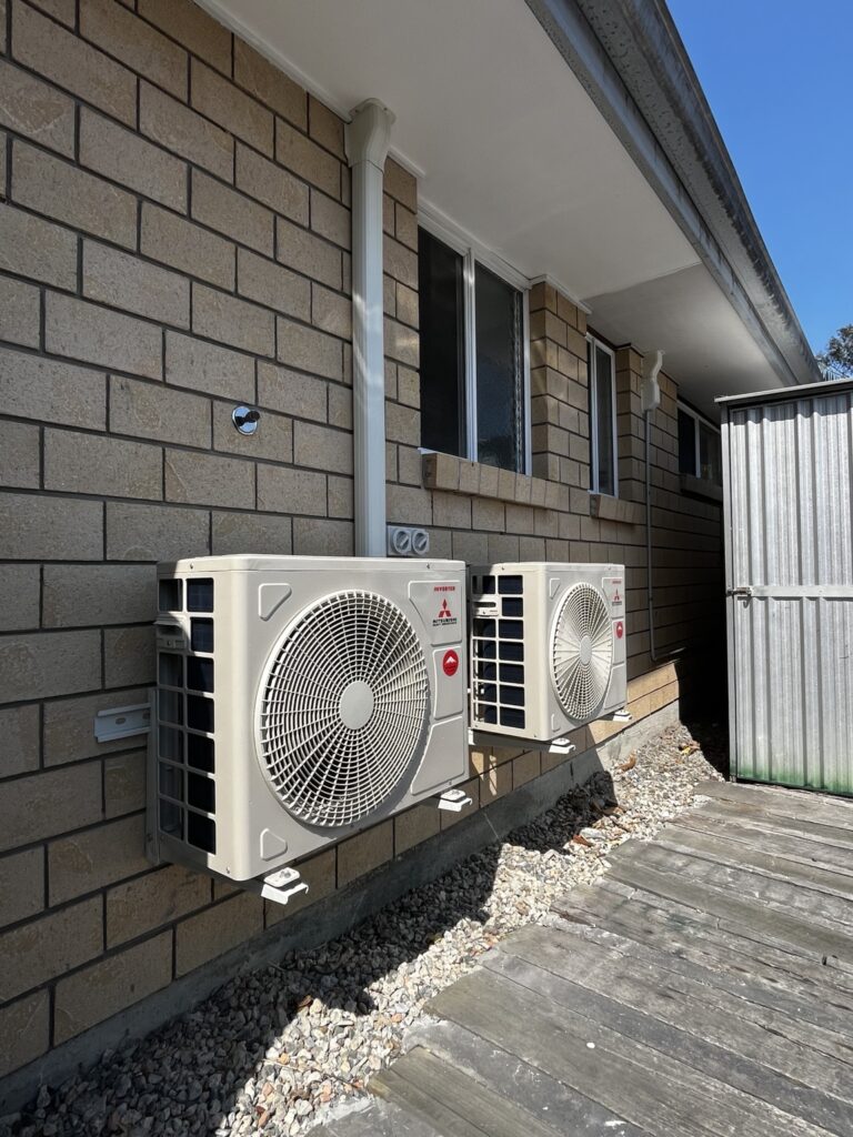 Two wall-mounted Mitsubishi Heavy Industries outdoor units installed in Edens Landing