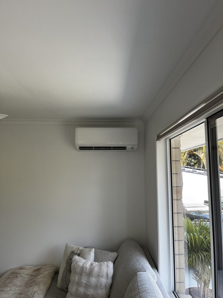 Mitsubishi Heavy Industries indoor unit installed above a sofa in Edens Landing