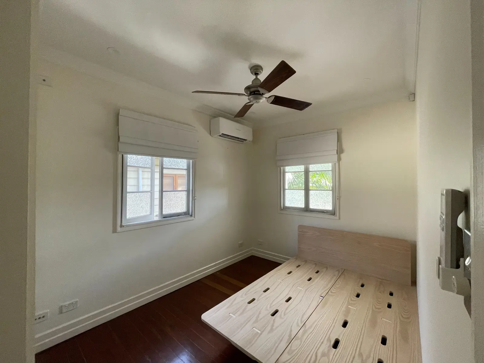 Completed split-system installation in a bright bedroom