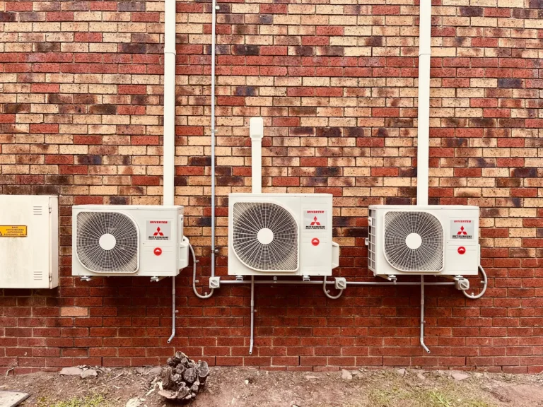 Three neatly installed Mitsubishi Heavy Industries outdoor units
