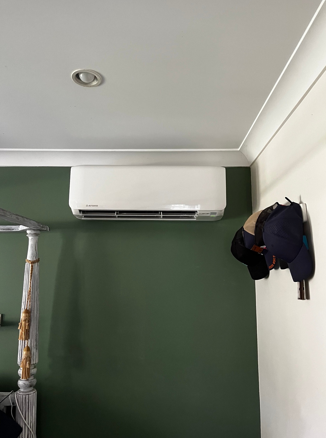 Mitsubishi Heavy Industries indoor unit installed on a green wall